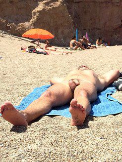 A naked guy sunbathing near me