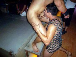 GoGo gay club, visitor sucks stripper cock