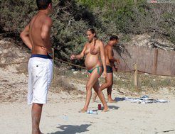 Pregnant nudist on the beach