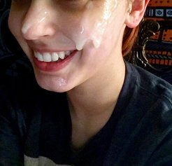 Her whole face is covered in cum