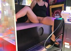 Ass and pussy flashing on the game center