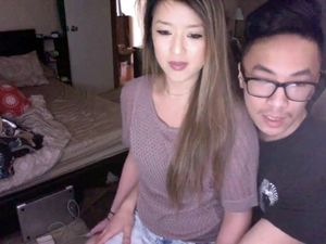 Asian American couple of students shows...