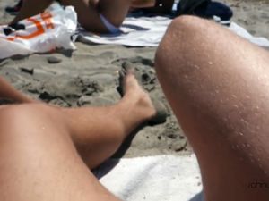 Two wives give blowjob at the beach for...