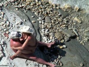 Mature couple fucking on the pebble beach...