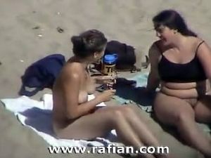 Oral sex on nude beach from voyeur camera