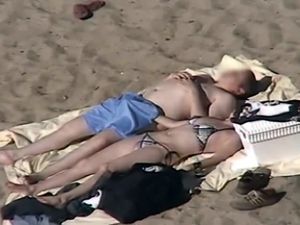Candid nude beach fucking filmed by...