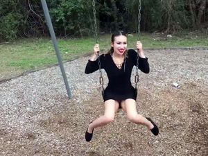 Without panties rides swing like a kid
