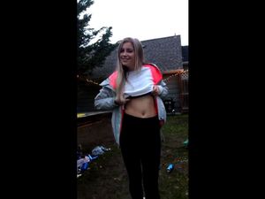 Blonde sister flashing tits in backyard