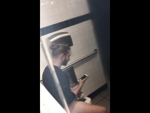 Horny guy masturbating cock right in toilet