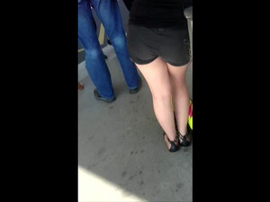 Cum over girl in black shorts in line for...