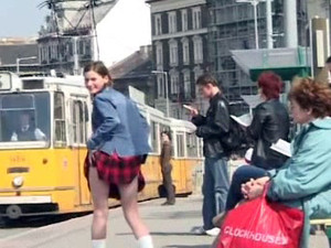 Shameless young bitch lifts her skirt at...