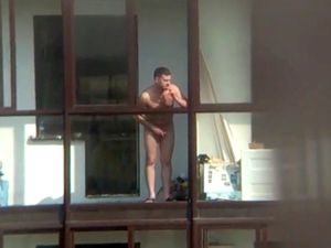 Naked man on the balcony in spy voyeur video