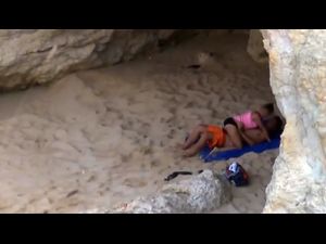 a couple have sex hiding under a rock